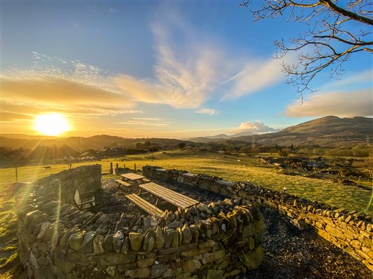 Sunset at Snowdonia Holiday Wales Tyddyn du Farm, Viewpoint for guests to enjoy. Dog friendly accommodation in North Wales luxury romantic cottages